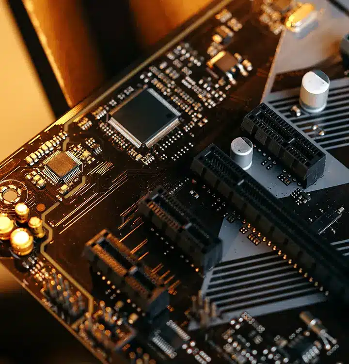 A detailed close-up view of a motherboard showcasing its intricate circuits and components.